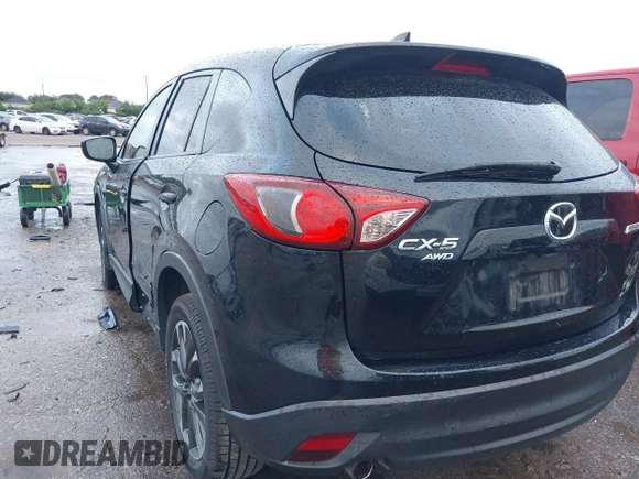 2016 Mazda CX-5 Grand Touring z VIN JM3KE4DY9G0605489, wystawiony jako IAAI lot #42085160 z przebiegiem 160 338 mil mil oraz . Historia ofert i sprzedaży dostępna na DreamBid. Obrazek 3.