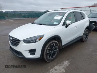 2016 Mazda CX-5 Grand Touring z VIN JM3KE4DY0G0705884, wystawiony jako IAAI lot #42016910 z przebiegiem 73 324 mil mil oraz . Historia ofert i sprzedaży dostępna na DreamBid. Obrazek 2.