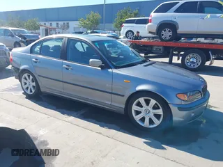 2003 BMW 3 Series 325i with VIN WBAAZ334X3KP81397, listed as a IAAI auction lot 41633863 with 128,133 mi miles. Bid and sale history available at carsss.com. Image 1.