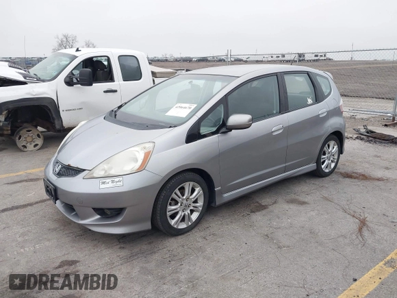 2009 Honda Fit Sport with VIN JHMGE88469S063030, listed as a IAAI auction lot 42064670 with 156,791 mi miles. Bid and sale history available at carsss.com. Image 2.