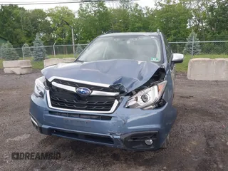 2018 Subaru Forester Touring with VIN JF2SJAWC5JH528330, listed as a IAAI auction lot 42344618 with 62,446 mi miles and . Bid and sale history available at DreamBid. Image 6.
