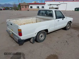 1991 Toyota Pickup DX z VIN JT4RN81P8M5123864, wystawiony jako IAAI lot #38084991 z przebiegiem 319 627 mil mil oraz . Historia ofert i sprzedaży dostępna na DreamBid. Obrazek 4.