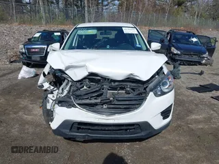 2016 Mazda CX-5 Sport with VIN JM3KE2BY9G0887110, listed as a IAAI auction lot 41761039 with 86,624 mi miles. Bid and sale history available at carsss.com. Image 13.