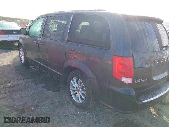 2014 Dodge Grand Caravan SXT with VIN 2C4RDGCG2ER267358, listed as a IAAI auction lot 41001692 with 186,763 mi miles and . Bid and sale history available at DreamBid. Image 3.
