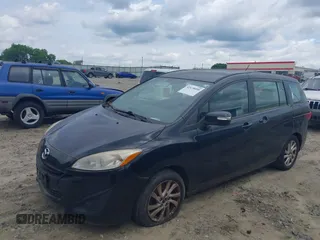 2013 Mazda 5 Sport z VIN JM1CW2BL9D0155084, wystawiony jako IAAI lot #42470090 z przebiegiem 133 038 mil mil oraz . Historia ofert i sprzedaży dostępna na DreamBid. Obrazek 2.