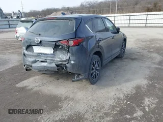 2018 Mazda CX-5 Grand Touring with VIN JM3KFBDM7J0338665, listed as a IAAI auction lot 41546019 with 141,740 mi miles. Bid and sale history available at carsss.com. Image 4.