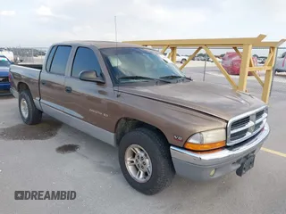 2000 Dodge Dakota Sport z VIN 1B7GL2AZ8YS716918, wystawiony jako IAAI lot #42467015 z przebiegiem 149 961 mil mil oraz . Historia ofert i sprzedaży dostępna na DreamBid. Obrazek 1.