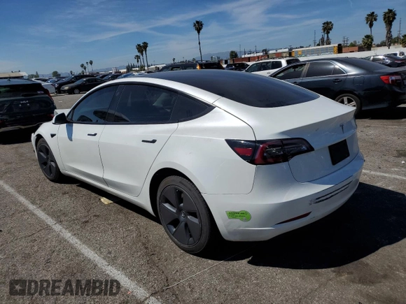 2023 Tesla Model 3 with VIN 5YJ3E1EA9PF401418, listed as a Copart auction lot 50597015 with 79,673 mi miles and Salvage Title. Bid and sale history available at DreamBid. Image 2.