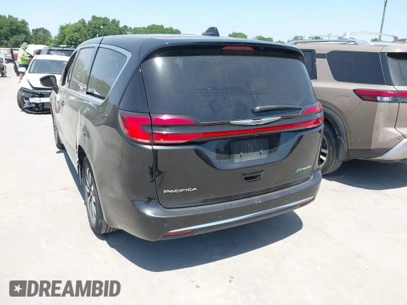2023 Chrysler Pacifica Hybrid Touring L z VIN 2C4RC1L77PR540958, wystawiony jako IAAI lot #42010484 z przebiegiem 61 166 mil mil oraz . Historia ofert i sprzedaży dostępna na DreamBid. Obrazek 3.