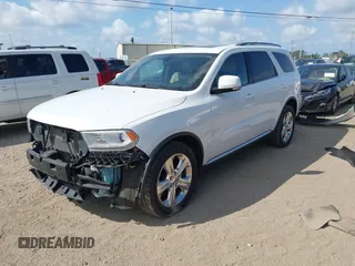 2014 Dodge Durango Limited with VIN 1C4RDJDGXEC323129, listed as a IAAI auction lot 42318727 with 148,451 mi miles and . Bid and sale history available at DreamBid. Image 2.