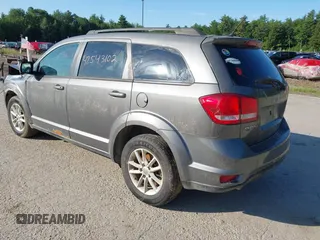 2013 Dodge Journey SXT with VIN 3C4PDDBGXDT607052, listed as a IAAI auction lot 42543102 with 157,325 mi miles and . Bid and sale history available at DreamBid. Image 3.