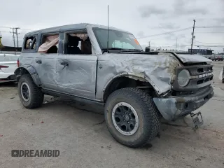 2022 Ford Bronco with VIN 1FMEE5DP1NLA98307, listed as a Copart auction lot 47690365 with 34,490 mi miles and Salvage Title. Bid and sale history available at DreamBid. Image 4.