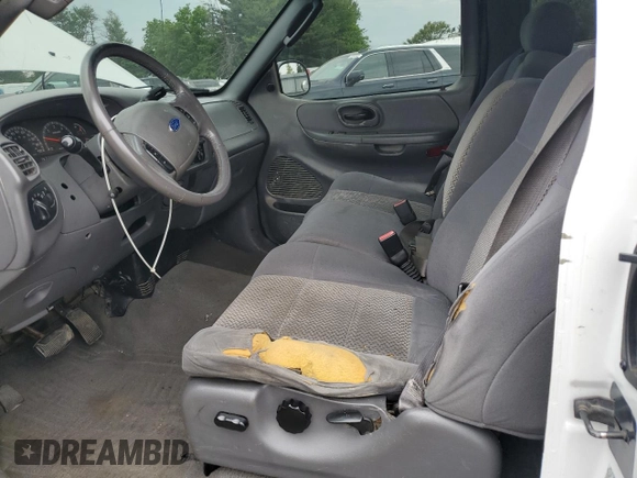 2003 Ford F-150 XL z VIN 2FTRX18L93CA55860, wystawiony jako Copart lot #57402295 z przebiegiem 312 879 mil mil oraz Szkoda całkowita • Salvage title. Historia ofert i sprzedaży dostępna na DreamBid. Obrazek 8.