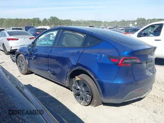 2025 Tesla Model Y Long Range with VIN 7SAYGDEEXSA346006, listed as a IAAI auction lot 41835610 with 1,896 mi miles and . Bid and sale history available at carsss.com. Image 14.