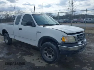 1999 Ford F-150 with VIN 1FTRX18W2XNB30523, listed as a IAAI auction lot 41617531 with 319,673 mi miles and . Bid and sale history available at DreamBid. Image 1.