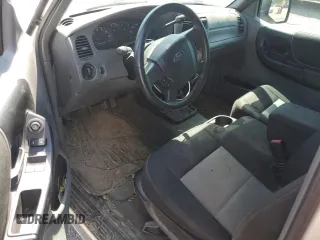 2010 Ford Ranger XL with VIN 1FTKR1ED2APA48348, listed as a Copart auction lot 52810865 with 399,192 mi miles and Salvage title. Bid and sale history available at DreamBid. Image 8.