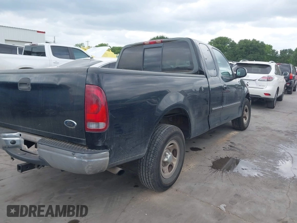 2002 Ford F-150 XL with VIN 1FTRX17202NA21470, listed as a IAAI auction lot 42098554 with 149,840 mi miles. Bid and sale history available at carsss.com. Image 4.