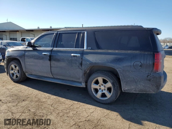 2015 Chevrolet Suburban LT with VIN 1GNSKJKC2FR274506, listed as a Copart auction lot 87881695 with 196,506 mi miles and Salvage Title. Bid and sale history available at DreamBid. Image 2.