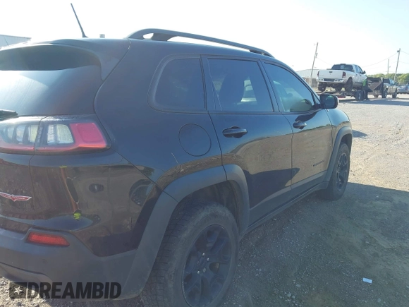 2019 Jeep Cherokee Trailhawk with VIN 1C4PJMBX3KD483895, listed as a IAAI auction lot 42696774 with 122,932 mi miles and . Bid and sale history available at DreamBid. Image 4.