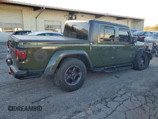 2021 Jeep Gladiator Rubicon with VIN 1C6JJTBM1ML599103, listed as a Copart auction lot 77084134 with 16,031 mi miles and Salvage title. Bid and sale history available at DreamBid. Image 3.