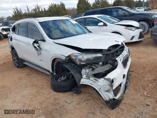 2018 BMW X1 sDrive28i with VIN WBXHU7C37J5H39401, listed as a IAAI auction lot 41421610 with 94,576 mi miles. Bid and sale history available at carsss.com. Image 1.