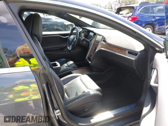 2017 Tesla Model S 100D with VIN 5YJSA1E27HF202563, listed as a IAAI auction lot 42460702 with 71,715 mi miles and . Bid and sale history available at DreamBid. Image 5.