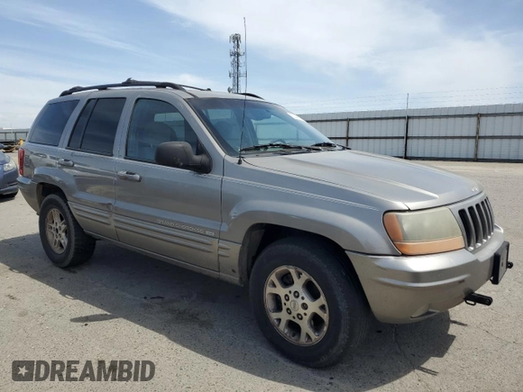 1999 Jeep Grand Cherokee Limited with VIN 1J4GW68N4XC663476, listed as a Copart auction lot 52449925 with 174,583 mi miles and Salvage Title. Bid and sale history available at carsss.com. Image 4.