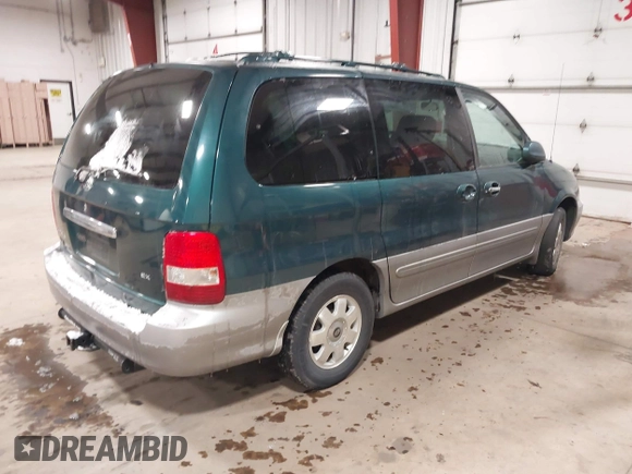 2003 Kia Sedona LX with VIN KNDUP131336390410, listed as a IAAI auction lot 41602426 with 170,613 mi miles. Bid and sale history available at carsss.com. Image 4.