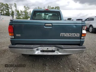 1999 Mazda B-Series Truck SX z VIN 4F4YR12CXXTM22296, wystawiony jako Copart lot #57175325 z przebiegiem 129 333 mil mil oraz Szkody całkowita. Historia ofert i sprzedaży dostępna na DreamBid. Obrazek 6.