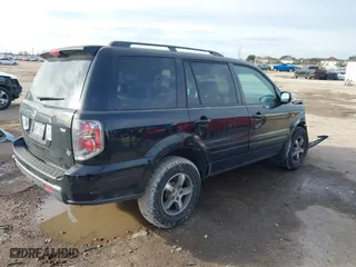 2007 Honda Pilot EX-L with VIN 5FNYF28557B027087, listed as a IAAI auction lot 41356244 with 183,923 mi miles. Bid and sale history available at carsss.com. Image 4.