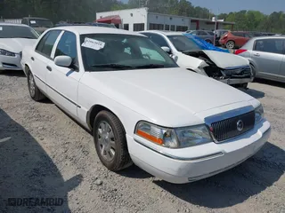 2003 Mercury Grand Marquis LS Premium with VIN 2MEFM75W33X669341, listed as a IAAI auction lot 42063018 with 124,047 mi miles. Bid and sale history available at carsss.com. Image 1.