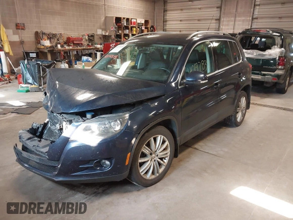 2011 Volkswagen Tiguan SE with VIN WVGBV7AXXBW533872, listed as a IAAI auction lot 40197835 with 104,685 mi miles and . Bid and sale history available at DreamBid. Image 17.
