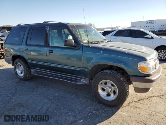 1997 Ford Explorer XL with VIN 1FMDU34E2VZC03015, listed as a Copart auction lot 80654764 with 295,587 mi miles and Salvage title. Bid and sale history available at DreamBid. Image 4.