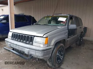 1995 Jeep Grand Cherokee Laredo with VIN 1J4GZ58SXSC697003, listed as a IAAI auction lot 41259889 with 248,595 mi miles. Bid and sale history available at carsss.com. Image 2.