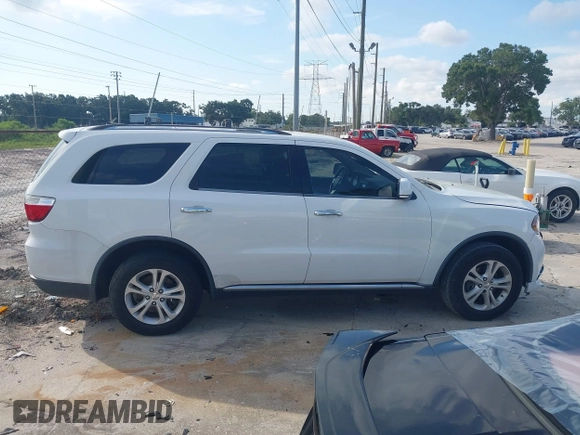 2013 Dodge Durango Crew with VIN 1C4RDHDGXDC608209, listed as a IAAI auction lot 42779231 with 203,460 mi miles and . Bid and sale history available at DreamBid. Image 13.