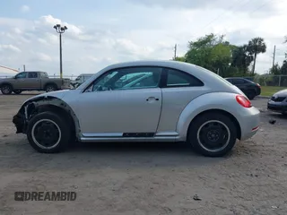 2012 Volkswagen Beetle 2.5L with VIN 3VWJX7AT9CM608065, listed as a IAAI auction lot 41864342 with 77,038 mi miles. Bid and sale history available at carsss.com. Image 14.