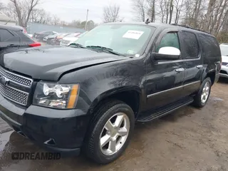 2012 Chevrolet Suburban LTZ with VIN 1GNSKKE74CR257156, listed as a IAAI auction lot 41486869 with 168,049 mi miles. Bid and sale history available at carsss.com. Image 2.