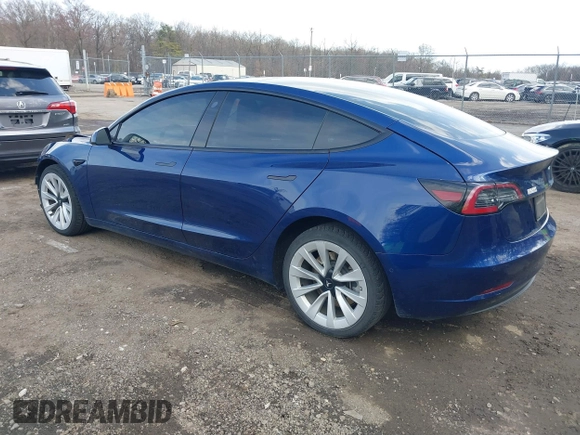 2022 Tesla Model 3 with VIN 5YJ3E1EA7NF188417, listed as a IAAI auction lot 41885623 with 105,457 mi miles and . Bid and sale history available at DreamBid. Image 3.