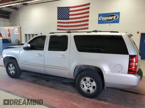 2014 Chevrolet Suburban LT with VIN 1GNSKJE77ER120211, listed as a Copart auction lot 62469424 with 213,282 mi miles and Salvage Title. Bid and sale history available at carsss.com. Image 2.
