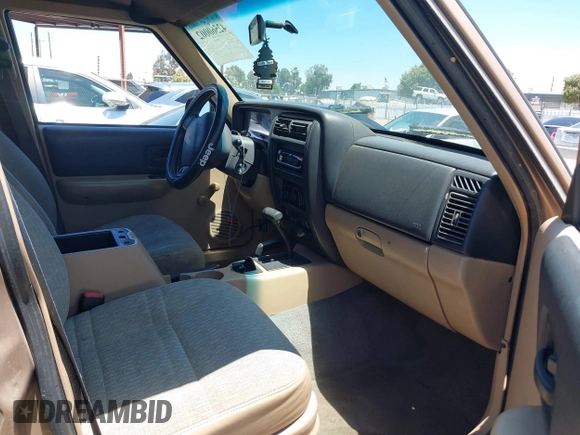 1999 Jeep Cherokee SE with VIN 1J4FF28S4XL592788, listed as a IAAI auction lot 42560002 with 189,258 mi miles and . Bid and sale history available at DreamBid. Image 5.