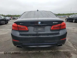 2019 BMW 5 Series 540i xDrive with VIN WBAJE7C54KWW19994, listed as a Copart auction lot 57973055 with 121,995 mi miles and Salvage title. Bid and sale history available at DreamBid. Image 6.