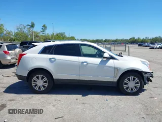 2016 Cadillac SRX Luxury Collection z VIN 3GYFNEE34GS513728, wystawiony jako IAAI lot #41847871 z przebiegiem 109 045 mil mil oraz . Historia ofert i sprzedaży dostępna na DreamBid. Obrazek 13.