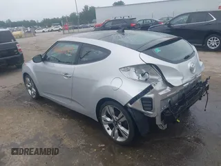 2012 Hyundai Veloster w/Black Int with VIN KMHTC6AD1CU034787, listed as a IAAI auction lot 42607847 with 126,912 mi miles and . Bid and sale history available at DreamBid. Image 3.