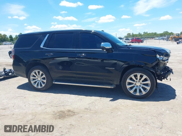 2021 Chevrolet Tahoe Premier with VIN 1GNSKSKDXMR195984, listed as a IAAI auction lot 42528305 with 89,925 mi miles and . Bid and sale history available at DreamBid. Image 14.