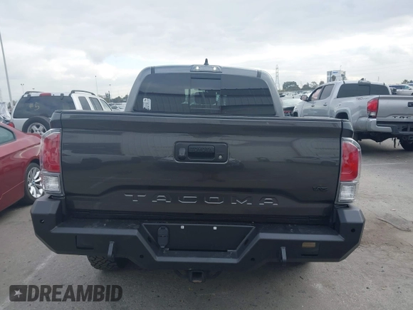 2021 Toyota Tacoma SR z VIN 3TMCZ5AN9MM397611, wystawiony jako IAAI lot #41467705 z przebiegiem 65 191 mil mil oraz . Historia ofert i sprzedaży dostępna na DreamBid. Obrazek 16.