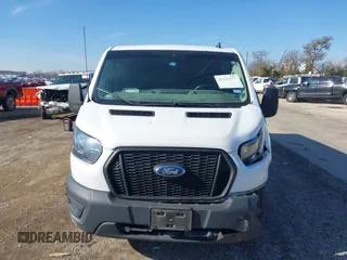 2022 Ford Transit Cargo with VIN 1FTYE1YG3NKA77243, listed as a IAAI auction lot 41231977 with 55,300 mi miles and . Bid and sale history available at DreamBid. Image 12.