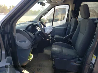 2015 Ford Transit with VIN 1FTNE1CM9FKA51425, listed as a Copart auction lot 70039184 with 146,782 mi miles and Salvage Title. Bid and sale history available at DreamBid. Image 7.