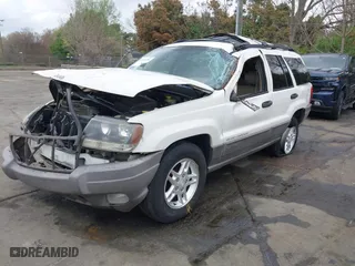 2003 Jeep Grand Cherokee Laredo with VIN 1J4GW48S33C521253, listed as a IAAI auction lot 41929756 with 209,686 mi miles. Bid and sale history available at carsss.com. Image 2.