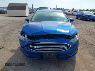 2017 Ford Fusion SE z VIN 3FA6P0H78HR195208, wystawiony jako IAAI lot #40384232 z przebiegiem 166 927 mil mil oraz . Historia ofert i sprzedaży dostępna na DreamBid. Obrazek 12.