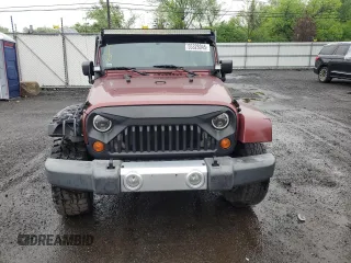 2008 Jeep Wrangler Sahara z VIN 1J4FA54198L505014, wystawiony jako Copart lot #55328045 z przebiegiem 128 049 mil mil oraz Szkoda całkowita • Salvage title. Historia ofert i sprzedaży dostępna na DreamBid. Obrazek 5.
